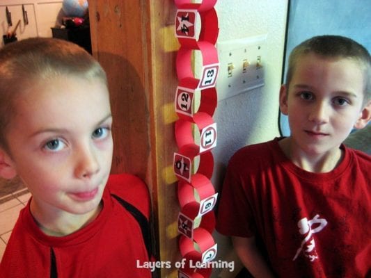 Make a paper chain advent calendar. This post has the free printable tags to put on your advent calendar, in blue and in red. Write one activity per day in December to do with your kids. They find out the activity when they tear off the ring.