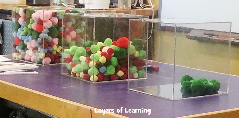 pom poms in a container showing states of matter